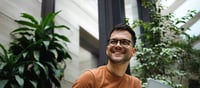 man with laptop smiling